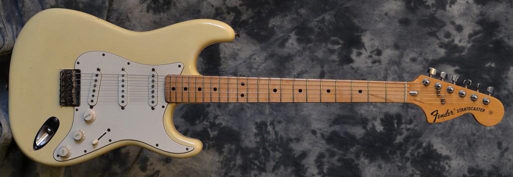 This early 70's strat has a white finish that has been aged to a nice cream look. It is all original except for the added Schaller tuners and comes with an older non original hardshell case.